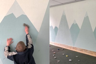 Kind an Kletterwand